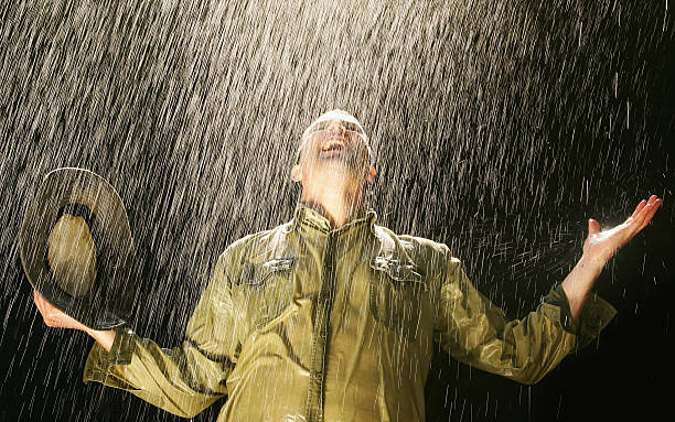 農家のレイン - rain drenched one person standing ストックフォトと画像