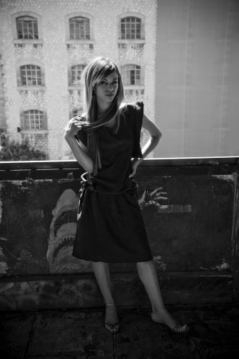 beautiful woman posing, playing with her hair, waiting bored. portrait black and white.