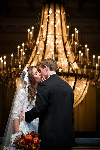 istock Bride and Groom Kissing with Elegant Chandelier 108178607