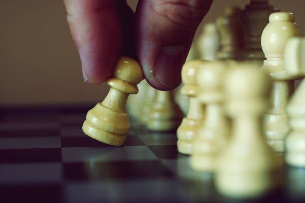 istock Chess board game, business competitive concept, difficult position to compete 1081787958