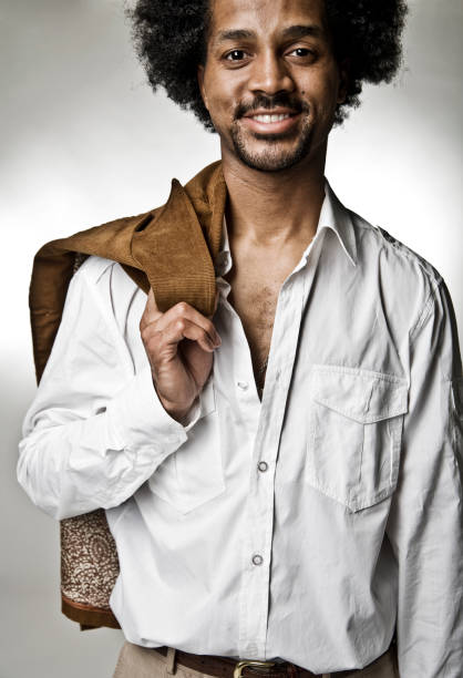 istock Young Man Holding Jacket Over Shoulder and Smiling 108178877