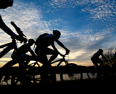 Group of bicyclists rides along the Arkansas River at sunset. Please see my other pictures of \n[url=http://www.istockphoto.com/my_lightbox_contents.php?lightboxID=1525420] real people working to stay healthy -- in the gym, biking, waterskiing, etc... [/url]Need photos representing the people, places and natural beauty of Arkansas? [url=http://www.istockphoto.com/my_lightbox_contents.php?lightboxID=3000143]Please see these... [/url]  Need photos having to do with bicycles? [url=http://www.istockphoto.com/my_lightbox_contents.php?lightboxID=3000143]Please see these... [/url] [url=file_closeup.php?id=1376460][img]file_thumbview_approve.php?size=1&id=1376460[/img][/url] [url=file_closeup.php?id=1776924][img]file_thumbview_approve.php?size=1&id=1776924[/img][/url] [url=file_closeup.php?id=1822277][img]file_thumbview_approve.php?size=1&id=1822277[/img][/url] [url=file_closeup.php?id=2058497][img]file_thumbview_approve.php?size=1&id=2058497[/img][/url] [url=file_closeup.php?id=2275868][img]file_thumbview_approve.php?size=1&id=2275868[/img][/url] [url=file_closeup.php?id=2275885][img]file_thumbview_approve.php?size=1&id=2275885[/img][/url] [url=file_closeup.php?id=3493500][img]file_thumbview_approve.php?size=1&id=3493500[/img][/url] [url=file_closeup.php?id=3744236][img]file_thumbview_approve.php?size=1&id=3744236[/img][/url] [url=file_closeup.php?id=3825682][img]file_thumbview_approve.php?size=1&id=3825682[/img][/url] [url=file_closeup.php?id=3825698][img]file_thumbview_approve.php?size=1&id=3825698[/img][/url] [url=file_closeup.php?id=3825713][img]file_thumbview_approve.php?size=1&id=3825713[/img][/url] [url=file_closeup.php?id=3948687][img]file_thumbview_approve.php?size=1&id=3948687[/img][/url] [url=file_closeup.php?id=3984422][img]file_thumbview_approve.php?size=1&id=3984422[/img][/url] [url=file_closeup.php?id=3991597][img]file_thumbview_approve.php?size=1&id=3991597[/img][/url]