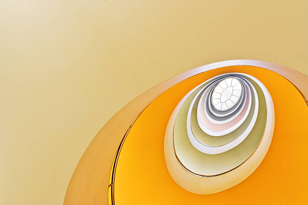 looking up at spiral staircase - modern fotos stockfoto's en -beelden