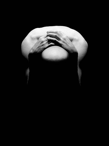 istock Nude person crouched over with hands over head in greyscale 108178984