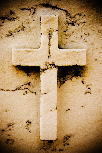 An old carved cross in granite.