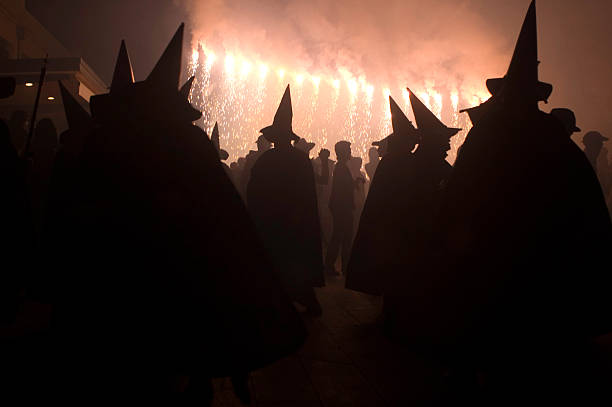 Silhouette of demon with horns, with fireworks, traditional Catalan summer party.