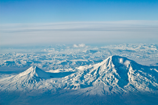 Caucasus Elbrus majestic mountain peak, blue sky lake, snow covered glacier, rocky landscape, alpine scenery