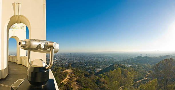 Chrome Telescope Looking Out Over Hollywood Hills  griffith park photos stock pictures, royalty-free photos & images