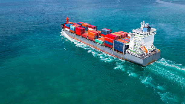 istock Aerial view container ship carrying container for import and export, business logistic and freight transportation by ship in open sea. 1081796842