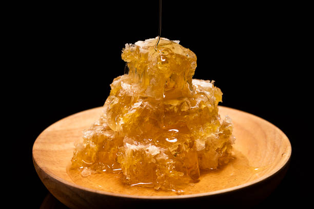 istock Honey hanging down Honeycomb 1081802960