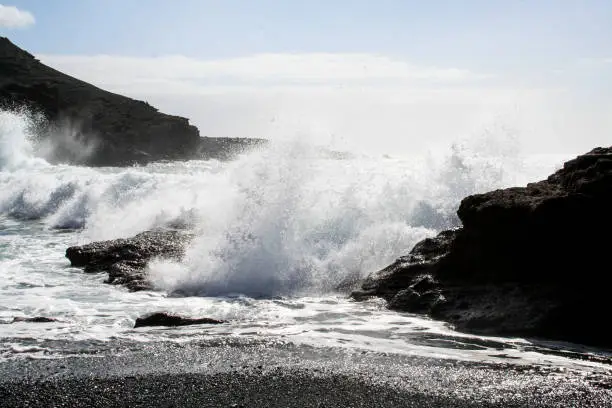 The beautiful wild ocean hitting the shore on the island of Lanzarote, Canary Islands
