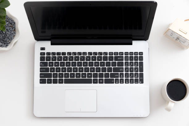Forefront of a gray laptop keyboard.