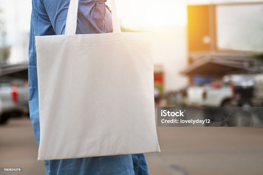 woman holding cotton bag for shopping. eco concept Tote Bag Stock Photo