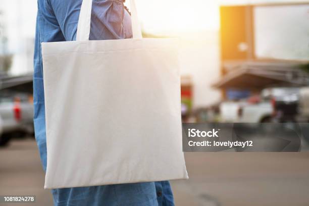 Woman Holding Cotton Bag For Shopping Eco Concept Stock Photo - Download Image Now - Tote Bag, Bag, Artist's Canvas