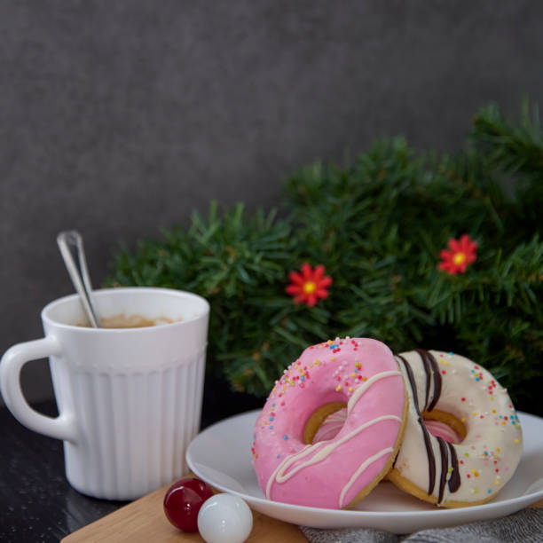 istock Pink Donuts on plate withe coffee on the dark wooden background 1081837584