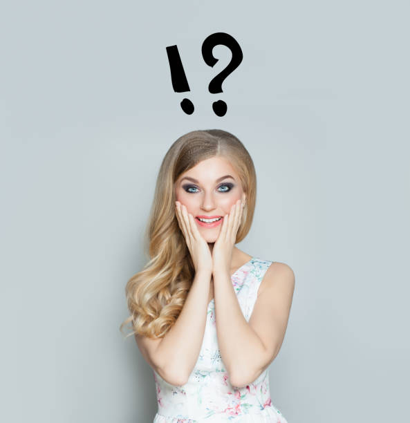 istock Surprise and idea concept. Happy surprised woman with question mark 1081839642