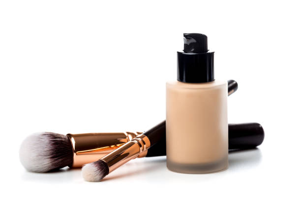 close-up of flat makeup brush with liquid foundation tube isolated on white - make up brush imagens e fotografias de stock