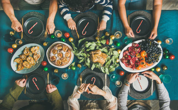 istock People ready to celebrate Christmas party dinner, top view 1081854210