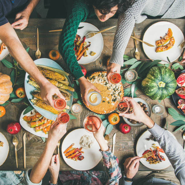 istock Friends clinking glasses at Thanksgiving Day, square crop 1081854262