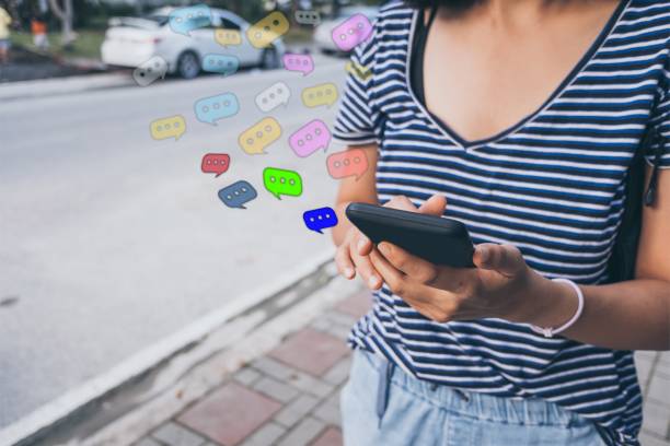 istock Woman hand using smartphone with chat icon background. Business communication social network concept. 1081854464