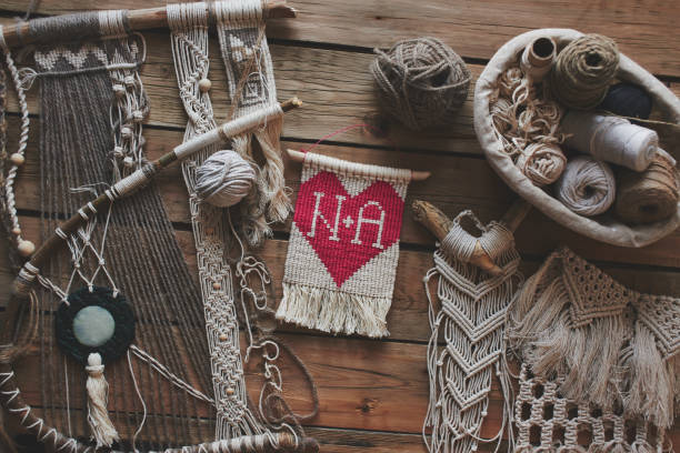 istock Macrame on a wooden table. Do it yourself. Love and heart. Top view. 1081856200