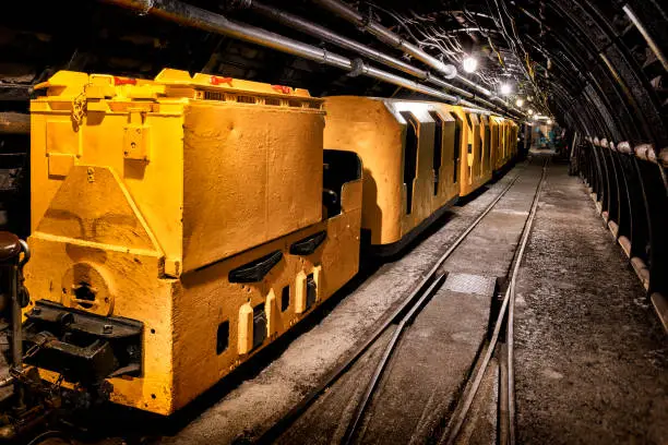 Coal mine underground corridor with freight railroad cars,  Bochum, Germany