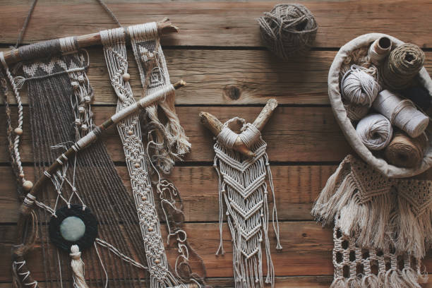 Macrame on a wooden table. Do it yourself. Top view.