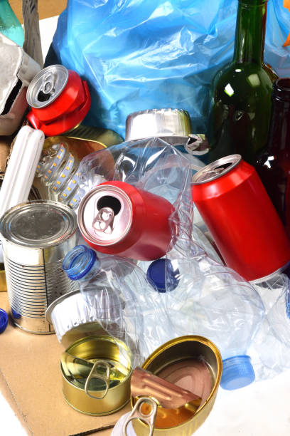 istock trash for recycling with, glass bottles, cans, plastic bottle and bulb 1081866972