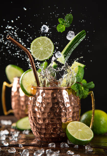 istock Famous splashing Moscow mule alcoholic cocktail in copper mugs. 1081867526