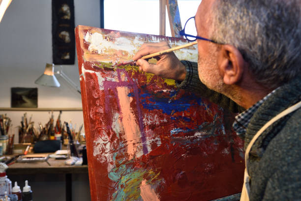istock Painter artist painting a picture in the studio 1081868826