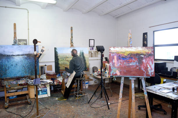 istock Painter artist painting a picture in the studio 1081868864