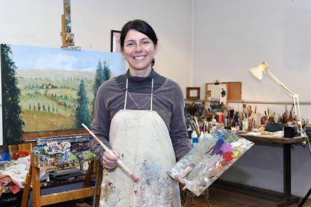 istock woman painting in a painting studio 1081868902