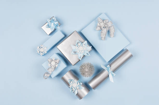 istock Love background - heart of different decorations, gift boxes, christmas tree in soft pastel blue and silver metallic color, top view. 1081871650