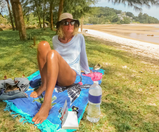 istock Woman chilling on green shoreline 1081875128