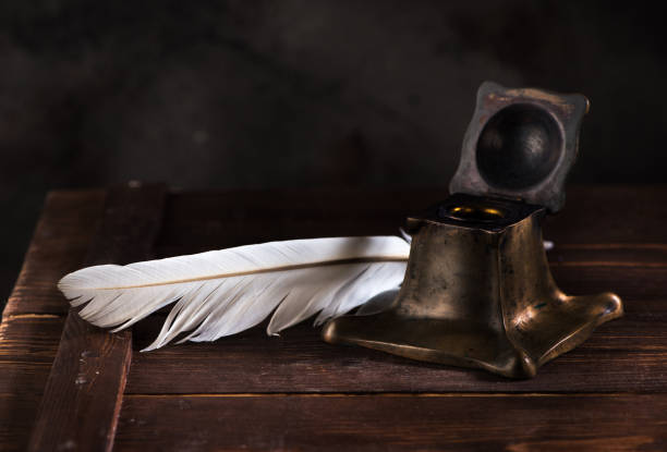 istock Ancient Inkwell and feather pen 1081878470