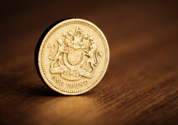 pound GBP coin on the desk stock photo