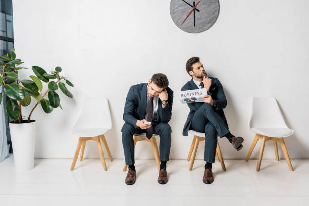 istock collage of nervous young businessman waiting in queue 1081881100