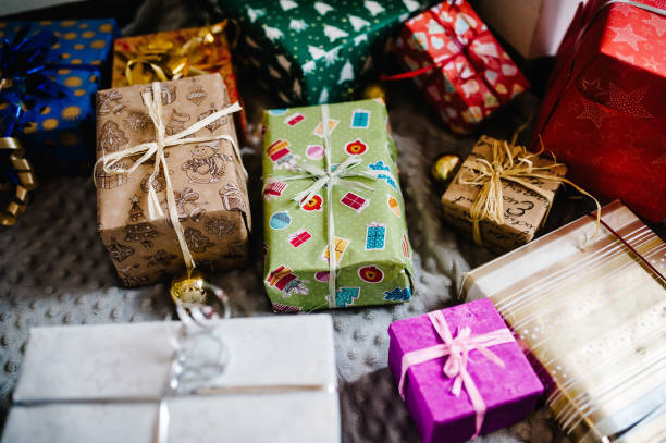 istock Gift boxes with ornaments on gray knitted background. space for text, design. Happy Holidays. top view. flat lay. stylish wrapped gifts. merry christmas, new year concept. birthday. Valentine's day. 1081881608