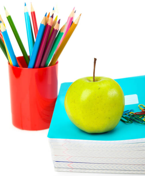 istock notebooks, pencils and apple. Back to school concept. 1081881640