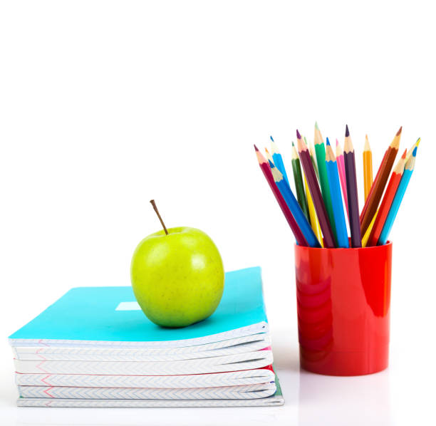 istock notebooks, pencils and apple. Back to school concept. 1081881654