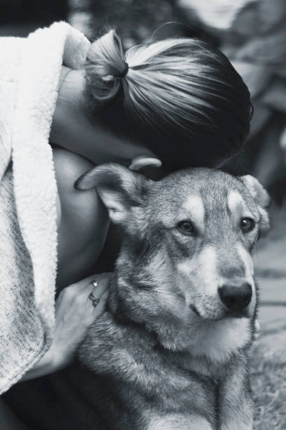 istock girl hugging a dog 1081883016