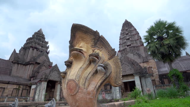 Ancient temple and sculpture of a cobra with 5 heads.
