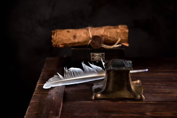 istock Ancient Inkwell, feather pen and old paper with a seal 1081883240
