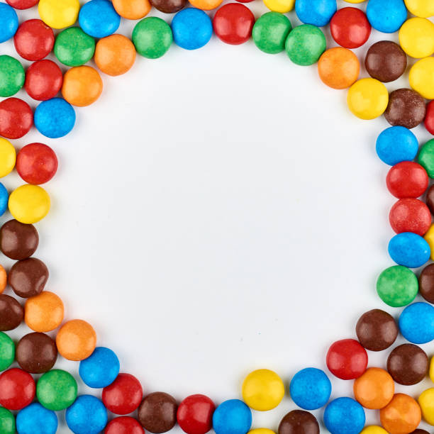 istock Abstract pattern with round color candy on background. Colorful sweets top view. Flat lay image 1081885880