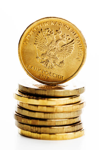 istock The Russian rouble coin and gold coins 1081886330