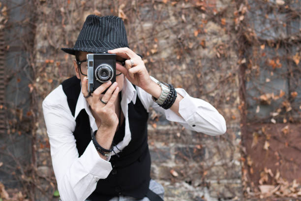 istock Taking picture with vintage photo camera. 1081888746
