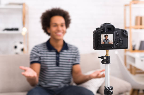 istock Happy video blogger on screen of modern camera 1081888962