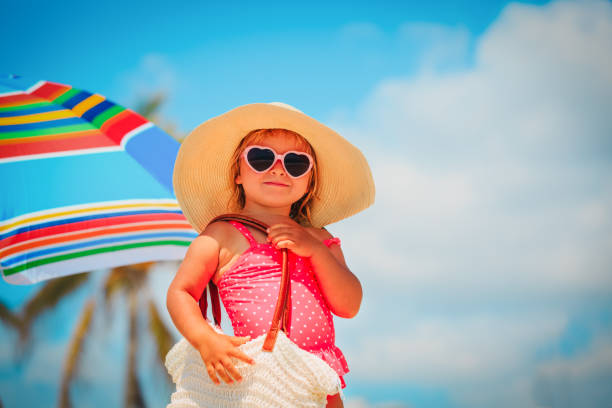 cute little girl with big bag on beach cute little girl with big bag on tropical beach beach bag stock pictures, royalty-free photos & images