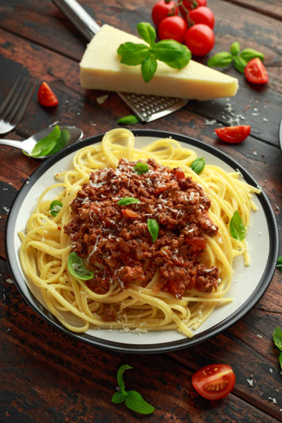 istock Italian pasta bolognese with beef, basil and parmesan cheese 1081892078