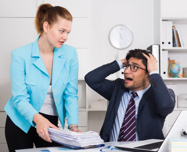istock Overworked businessman with sheaf of papers 1081892734